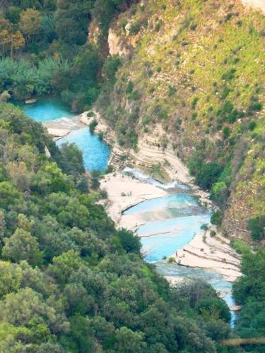 an aerial view of a river in a mountain at Agriturismo Alle Riserve Cavagrande in Avola