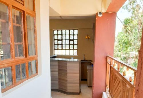 a view of a kitchen from the balcony of a house at Villa De Leo in Bungoma