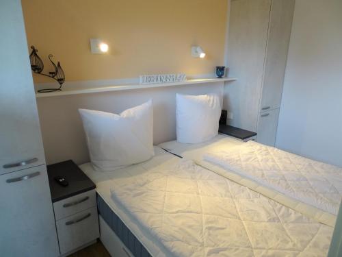 Postel nebo postele na pokoji v ubytování Lütt Plambeck-Appartement Melanie EG 2