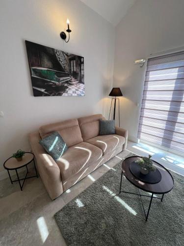 a living room with a couch and a table at Casa del Sole Lux in Kotor