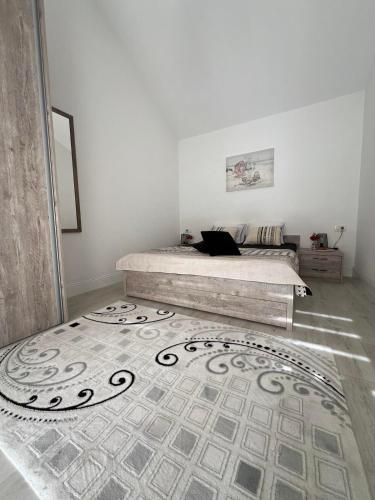 a bedroom with a bed and a rug at Casa del Sole Lux in Kotor