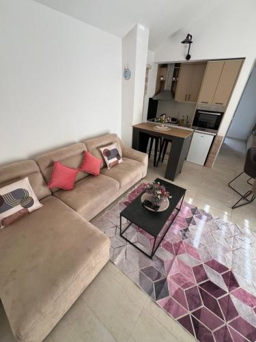 a living room with a couch and a table at Casa del Sole Lux in Kotor