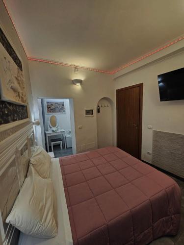 Letto o letti in una camera di A&F Colosseo
