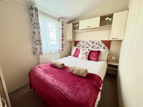 Ένα ή περισσότερα κρεβάτια σε δωμάτιο στο Lemon Tree Lodge, Dog Friendly, Free Hoburne Passes