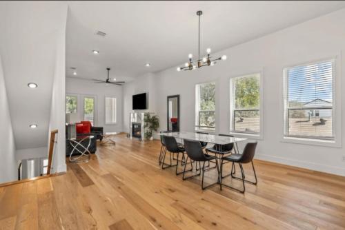 a dining room and living room with a table and chairs at Muncie U Too at Trinity Grove in Dallas