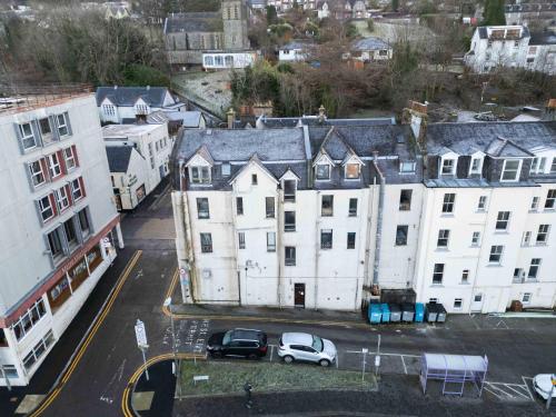 an aerial view of a city with buildings and cars at Prime location rooms in high street in Fort William