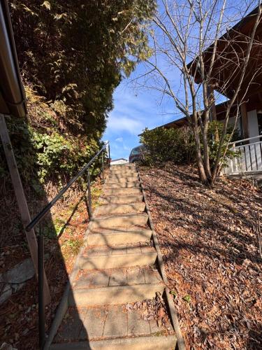 a stepping stone path leading to a house at Cozy StudioApartment with Graden in Graz Free Parking in Graz