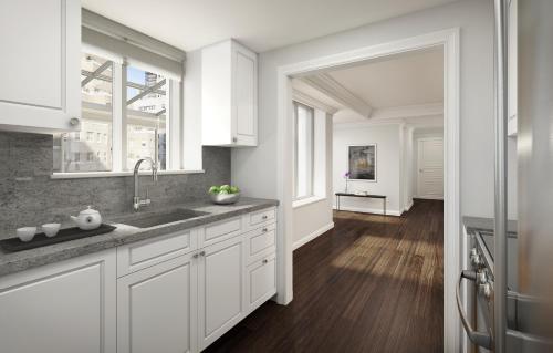 a white kitchen with a sink and a window at AKA Sutton Place in New York