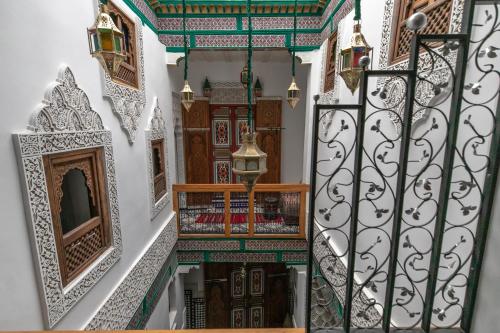 an overhead view of a stairway with a gate at Dar Amazigh in Fès