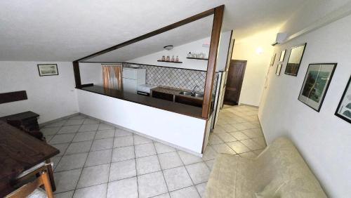 a room with a staircase with a sink in it at Solmar Apartments in Biancareddu