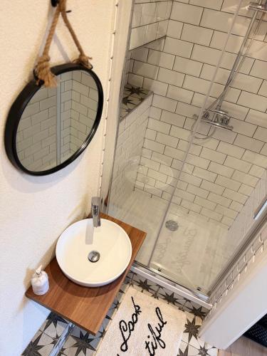 a bathroom with a sink and a shower at Apartment Dubnica Prejta in Dubnica nad Váhom