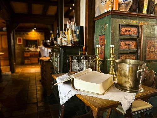 a table in a bar with a book on it at Landgasthof Zum Weissen Schwanen in Braubach