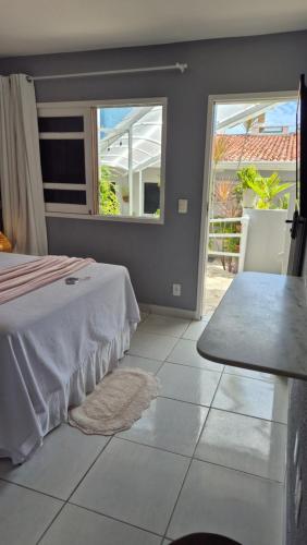 Ein Bett oder Betten in einem Zimmer der Unterkunft Pousada America do Sol