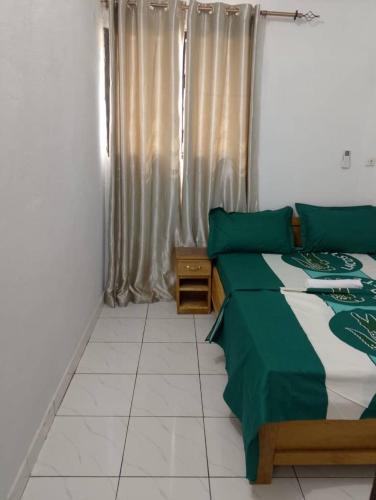 Llit o llits en una habitació de Résidence la rose