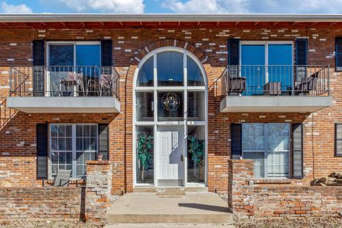 a brick house with a white door and balcony at 604 1 Two Bedroom One Bath with King near Main Street in St. Charles