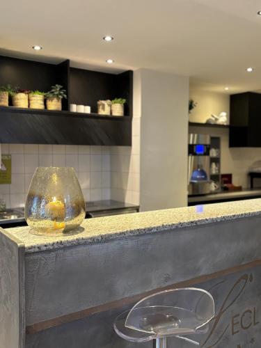 a counter with a glass bowl on top of it at Hôtel de l'Ecluse in Neuchâtel
