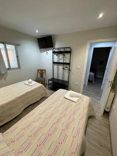 Postel nebo postele na pokoji v ubytování Casa Cea Ourense