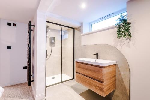 a bathroom with a sink and a shower at The Nook in Manchester