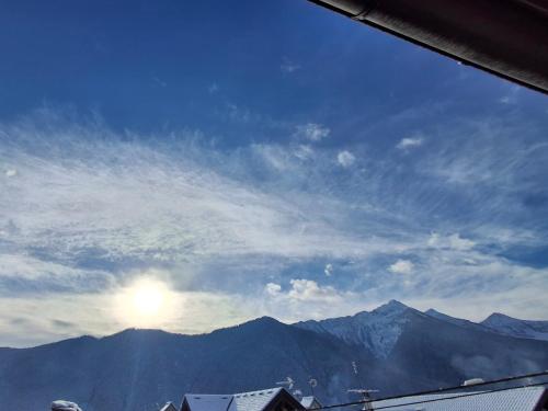 a view of the mountains with the sun in the sky at Casa Jedi in Santa Maria Maggiore
