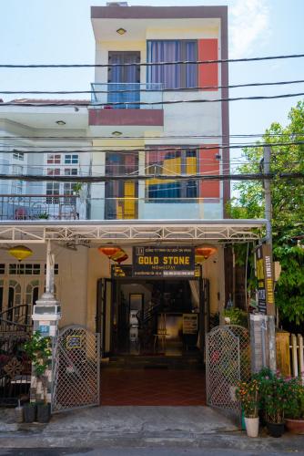 a building with a sign that reads hotel stone at Gold Stone Hoi An Homestay in Hoi An