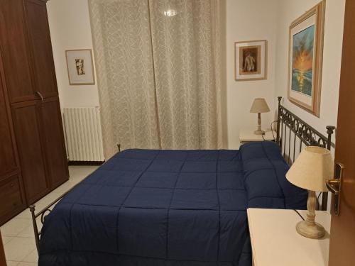 Ένα ή περισσότερα κρεβάτια σε δωμάτιο στο Casa Vacanze VIAGGI DIPINTI