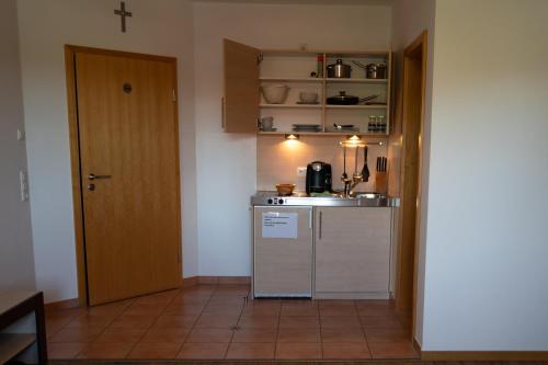Kuchyň nebo kuchyňský kout v ubytování Gästehaus Roming