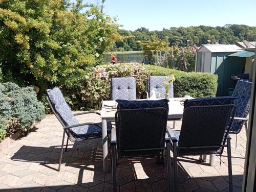 a table and chairs sitting on a patio at Bungalow Seestern in Malchow