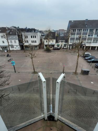 a fence in a parking lot with a park at Studio No 3 in Heinsberg