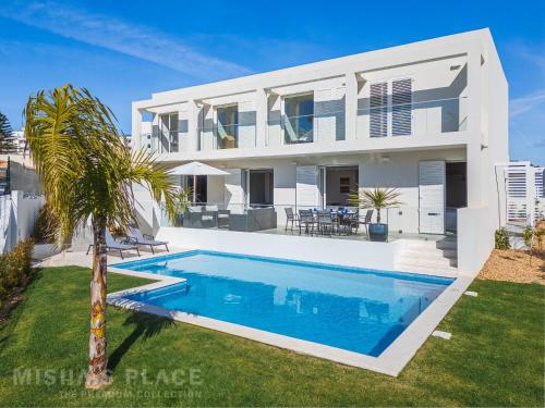 an image of a villa with a swimming pool at Modern 5BR Villa-Private Pool-Walk to Beach & Oura-10 Guests by Misha's Place in Albufeira