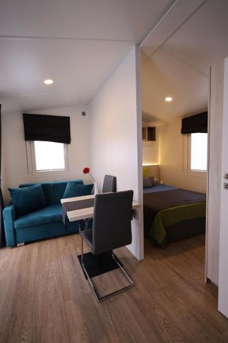 Ένα ή περισσότερα κρεβάτια σε δωμάτιο στο Mobilheim Summer Lounge Appartment II