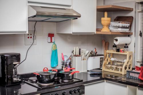 Η κουζίνα ή μικρή κουζίνα στο Monitaet Apartments
