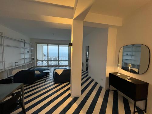 a living room with a view of the ocean at Oltremare in Brucoli
