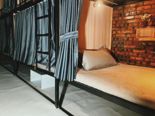 Ένα ή περισσότερα κρεβάτια σε δωμάτιο στο Venn Hostels