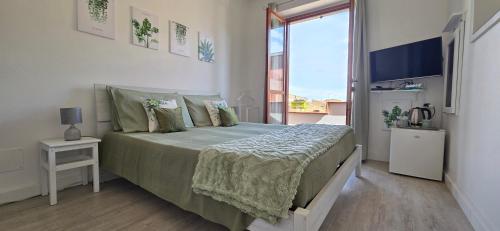 Posteľ alebo postele v izbe v ubytovaní Casa Rosy - Stanza privata con bagno esclusivo e parcheggio gratuito