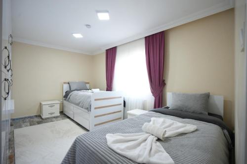Postel nebo postele na pokoji v ubytování Çilek Home