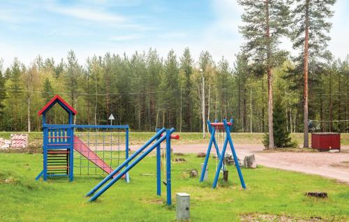 a playground with colorful play equipment in a field at Stunning Apartment In Ljørdalen in Ljørdalen