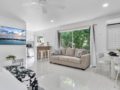 a living room with a couch and a table at Beachside Studio in Hollywood