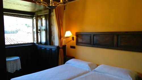 Кровать или кровати в номере Casa de Aldea El Torrexon