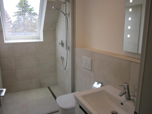 a bathroom with a shower and a sink at Ferienwohnung in Westerland auf Sylt in Westerland (Sylt)