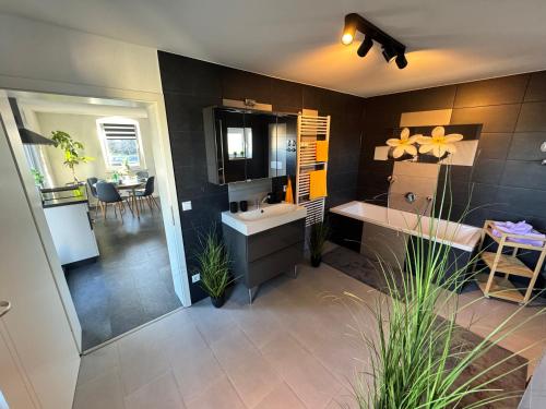 a large bathroom with a sink and a counter at ErzgebirgsLoft in Annaberg-Buchholz