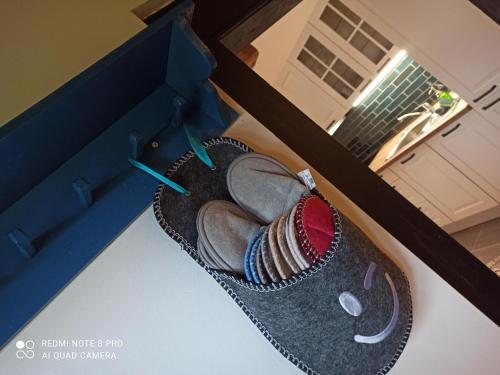 a basket with some shoes in a room at Kellerstöckl am Kurzlangberg in Eberau