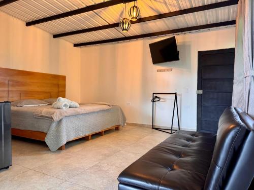 Ένα ή περισσότερα κρεβάτια σε δωμάτιο στο Hotel Campestre Alto lindo en Guatapé