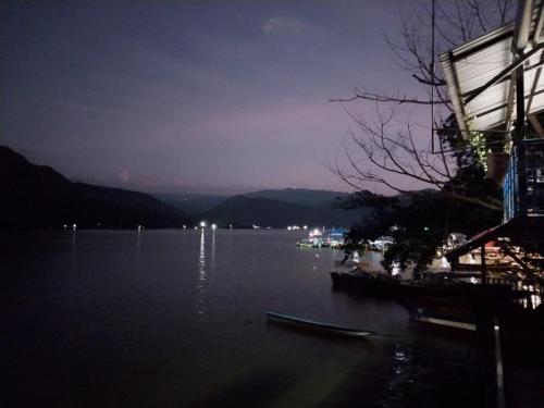a view of a lake at night at Apto en la represa de prado, Tolima in Boquerón de Tena