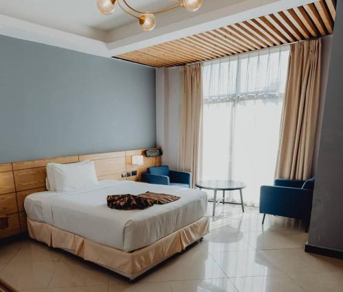 Giường trong phòng chung tại Mazeki Addis Boutique Hotel