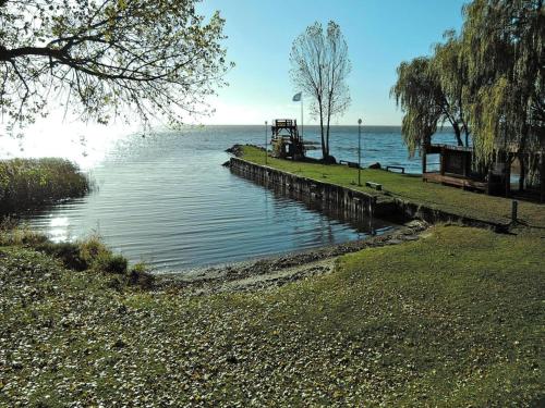 a dock in the middle of a body of water at Holiday Home in Sulomino with Private Beach in Dargobądz