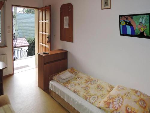 En eller flere senge i et værelse på Holiday Home Pobierowo near Baltic Beach