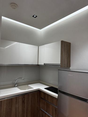 a kitchen with a sink and a refrigerator at Apartments Costa Azzurra in Velipojë