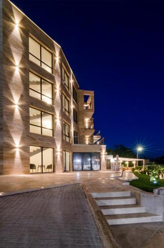 a building with lights on it at night at Villa Ambra in Tyulenovo