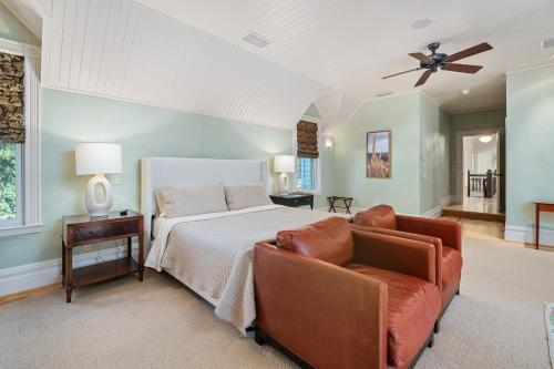 a bedroom with a bed and a couch at 1800s Victorian Home- Halter Ranch in Adelaida