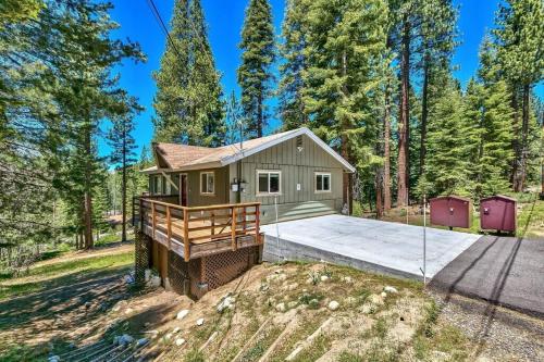 a home for sale in the woods with a large backyard at Bear Haus - Sledding At Cabin - Forest Views - Foosball in South Lake Tahoe